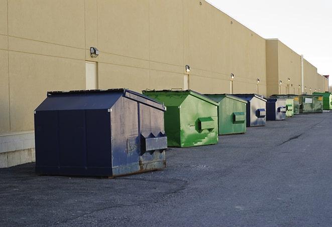 a group of construction workers taking a break near a dumpster in Alviso, CA